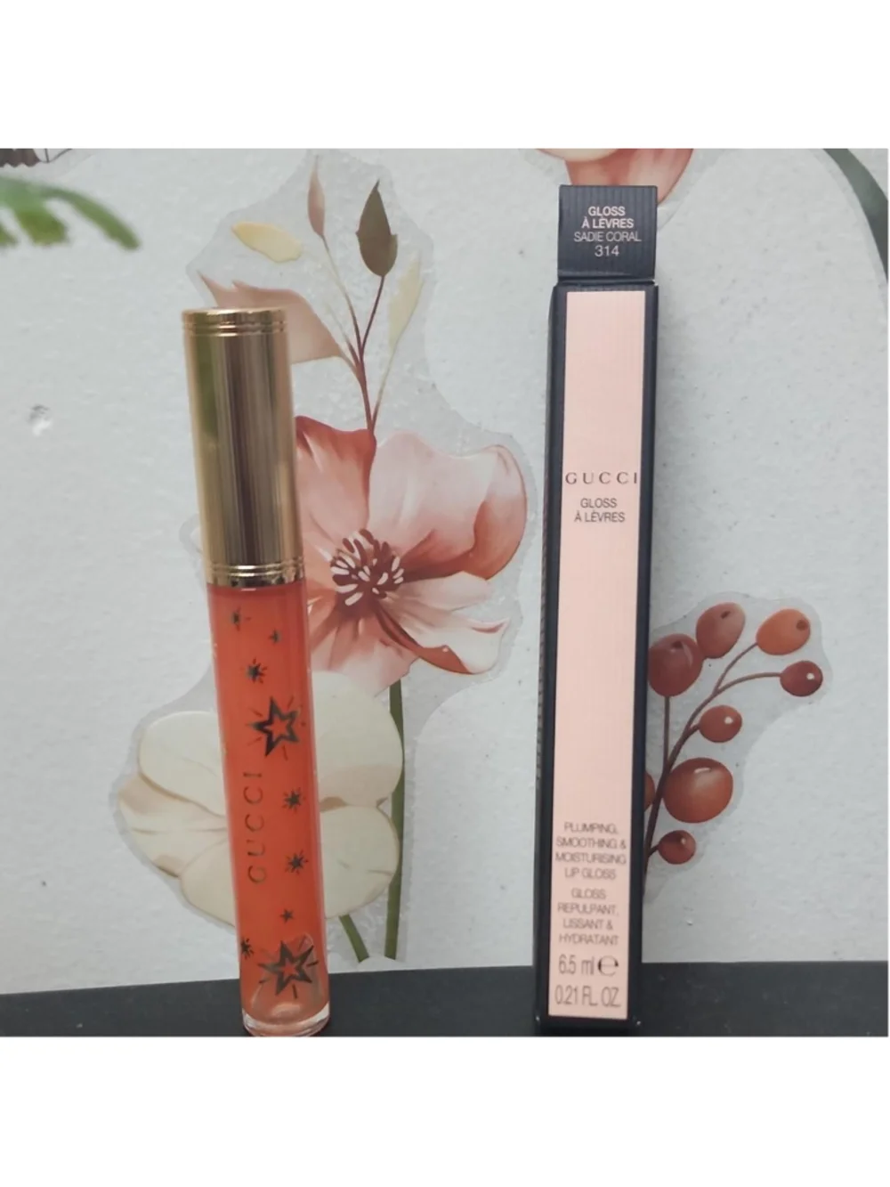Gucci lip gloss in shade 314 Sade Coral